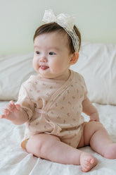Baby Sitting in Avauma Clare Peach Cream Short Sleeve Floral Bodysuit, Soft Cotton Babywear